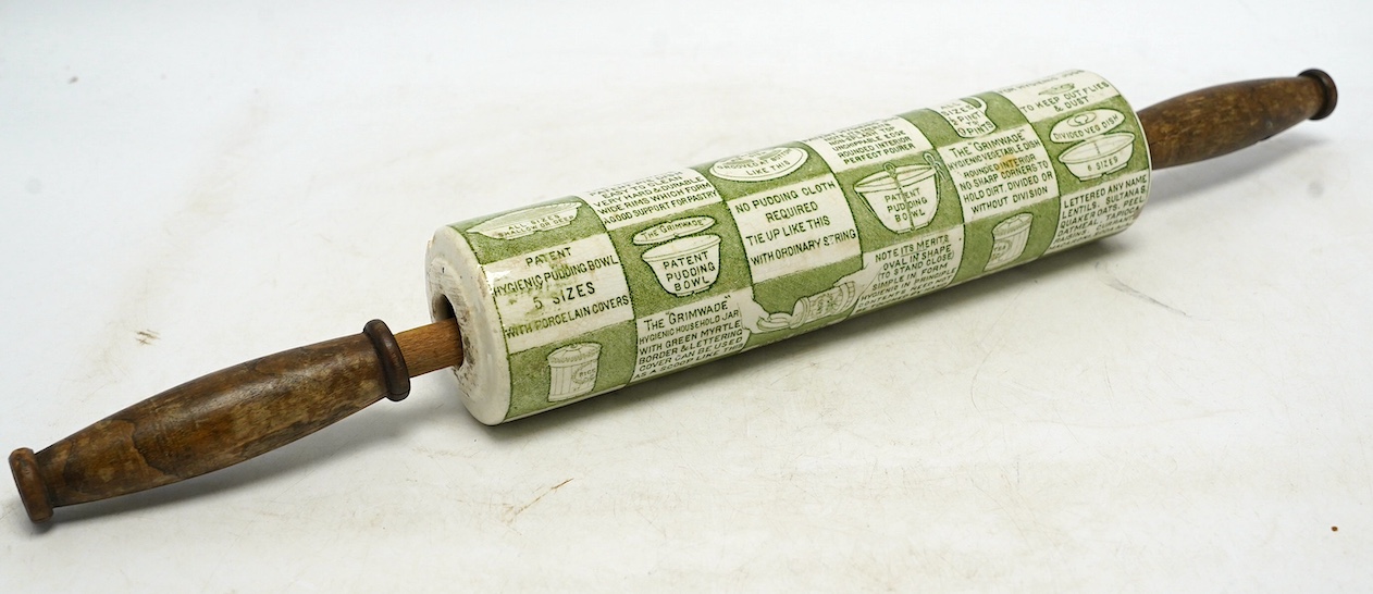 An early 20th century Grimwades green printed earthenware promotional rolling pin, 47cm wide. Condition - poor to fair